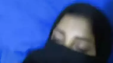 Girl covering face with hizab