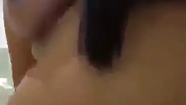 Tamil porn of a girl riding after putting a condom on a dick
