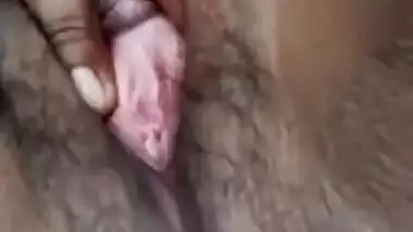 Young village girl spreads legs to rub virgin Desi bush in XXX video