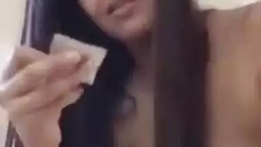 Teen exposes her XXX body and prepares a condom for subsequent sex