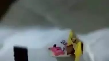 There is a hole in the bathroom and perv films the naked Indian