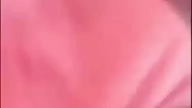 Indian chick in a red robe bares her natural XXX breasts to the sex fan