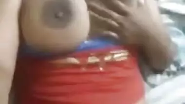 Desi charmer fools around in bed with XXX sized breasts naked in MMS