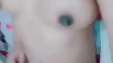 Lovely Desi with bright-red lipstick lies in bed with naked XXX parts