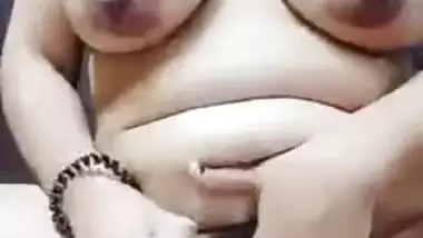 Chubby Desi model with big tits sticks sex toy into her XXX slit