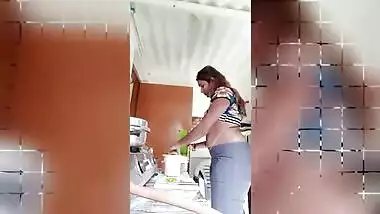 Chubby Desi gal while cooking can barely hide her perky XXX boobs