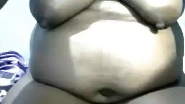Mature Indian webcam porn model with huge belly spreads her pussy lips