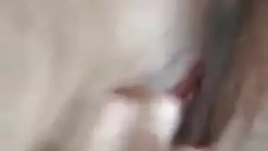 Naked Indian holds camera with one hand and fingers XXX hole with another