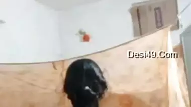 Sexy housewife strips and shakes her big Desi booty for the camera